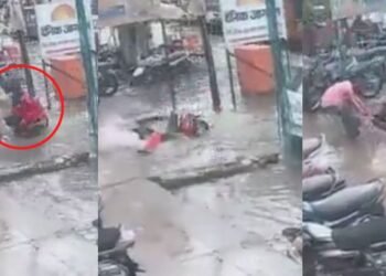 বৰষুণত ঘৰৰ পৰা ওলালে হওক সাৱধান! মুষলধাৰ বৰষুণত পত্নীসহ নলাত বাগৰি পৰে এজন আৰক্ষী; ঘটনাস্থলীত থকা কিছুমান লোকৰ সহায়ত প্ৰাণ ৰক্ষা পৰিল স্বামীসহ পত্নীৰ, Watch Viral Video